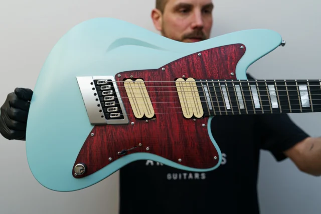 Aristides STX7S Mint Green Pearl equipped with our multiscale @evertune as well as @bareknucklepickupsofficial Halcyons, and a custom Flamed Red Marble pickguard!