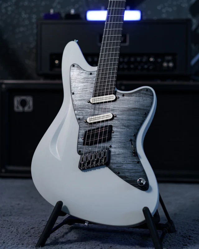 Aristides STX6SR Light Grey loaded with @bareknucklepickupsofficial Impulses in HSS along with a gorgeous custom flamed dark grey marble pickguard and chrome hardware!