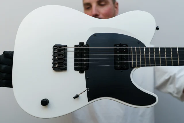 Aristides T/0R White loaded with @bareknucklepickupsofficial PolyPafs and a black pickguard!