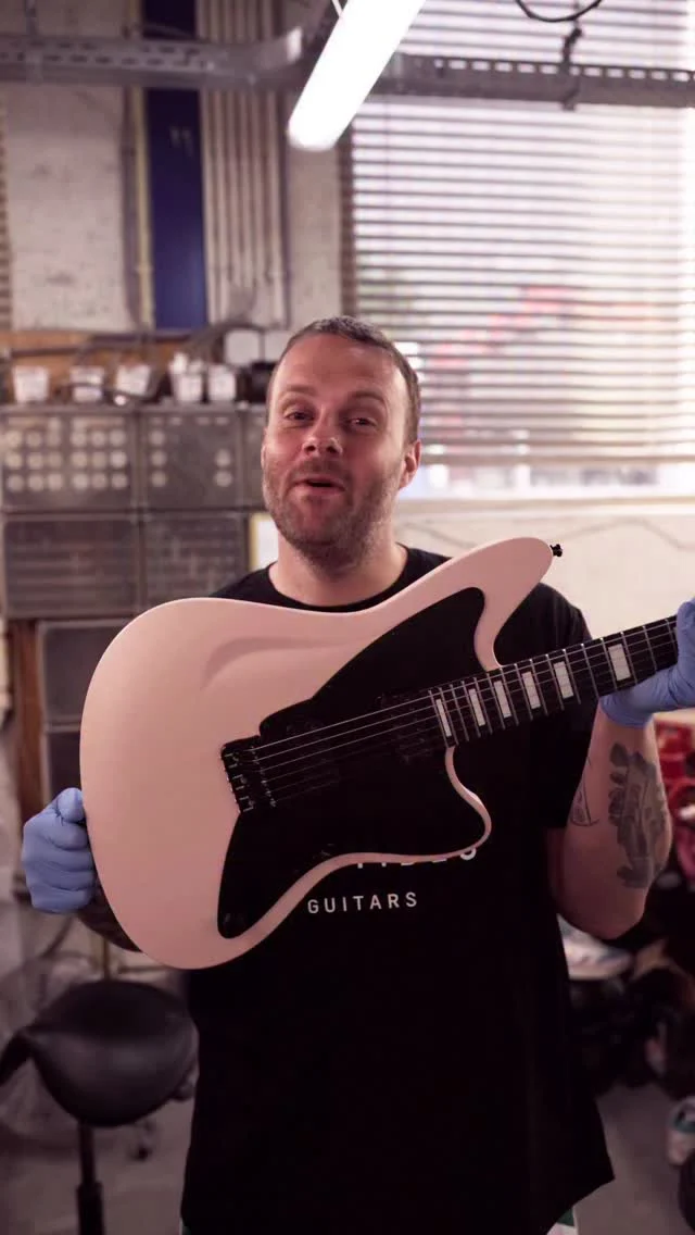 Build of the Week Aristides STX6R Shell Pink equipped with Seymour Duncan Pegasus Sentient pickups alongside white epoxy block inlays, and a black pickguard!