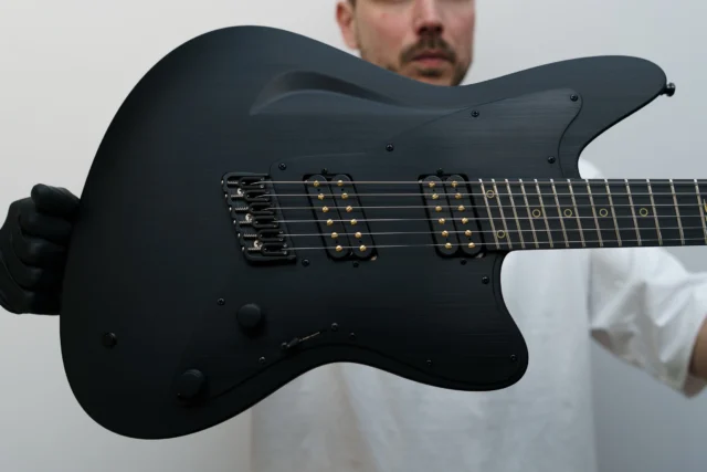Aristides STX6SR Black loaded with @bareknucklepickupsofficial Impulses, gold ring inlays, a killswitch, black pickguard, and black painted backplate! 🖤🤘