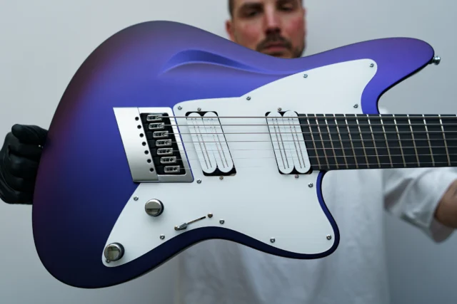 Aristides STX7S Blueberry Chameleon Satin with a white pickguard, multiscale @evertune in brushed chrome, and white @bareknucklepickupsofficial Halcyons!