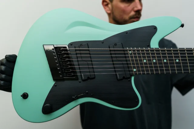 Aristides STX8SR Seafoam featuring @fishmanmusic Moderns with a black pickguard and raw painted back plate!