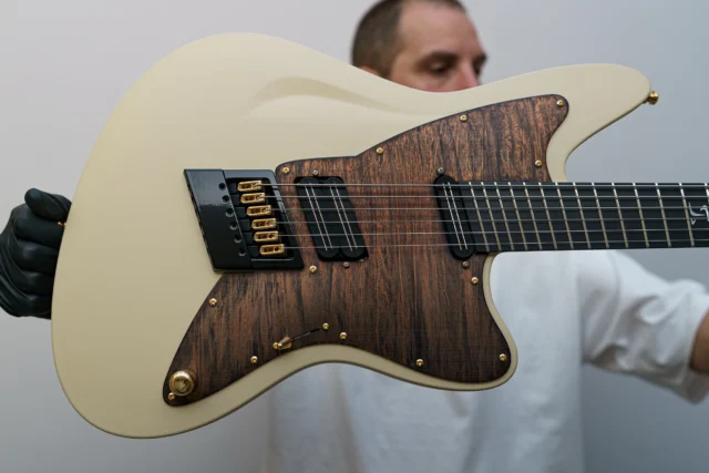 Aristides STX6SR Desert Tan loaded with a multiscale @evertune in hybrid hardware along with a gorgeous flame brown pickguard and a @bareknucklepickupsofficial Impulse set in H/S configuration!