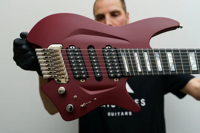 Aristides H/08R Royal Red equipped with our multiscale tremolo, MOP block inlays, and @bareknucklepickupsofficial Silos + a Trypytch!
