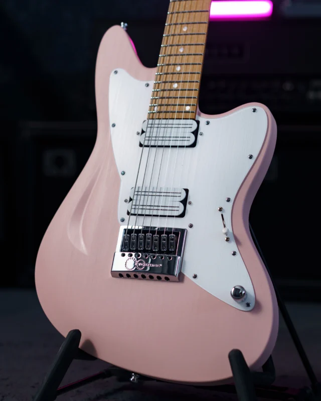 Aristides STX7R Shell Pink equipped with the mighty @bareknucklepickupsofficial Halcyons, an EverTune and a white raw pickguard!